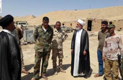 مبلغو لجنة الإرشاد والتعبئة للدفاع عن عراق المقدسات يرافقون موكب أهالي الحفرية للدعم اللوجستي